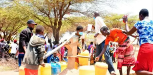 Photo of residents at the borehole. 